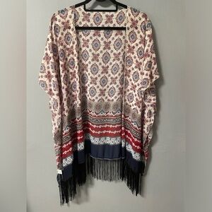 Kimono open style with stitched arm holes and short sleeves. One size